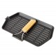 Campfire cast iron griddle frypan with ridged cooking surface and wooden handle designed for camping, barbecues, outdoor cooking and campfire grilling