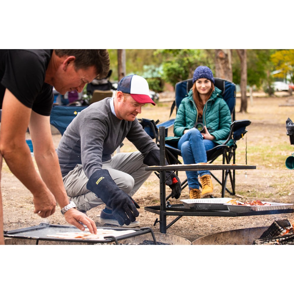 Campfire cooking grill combo with mesh grill racks and solid hotplate surface designed for campfire cooking, outdoor grilling and campsite meal preparation