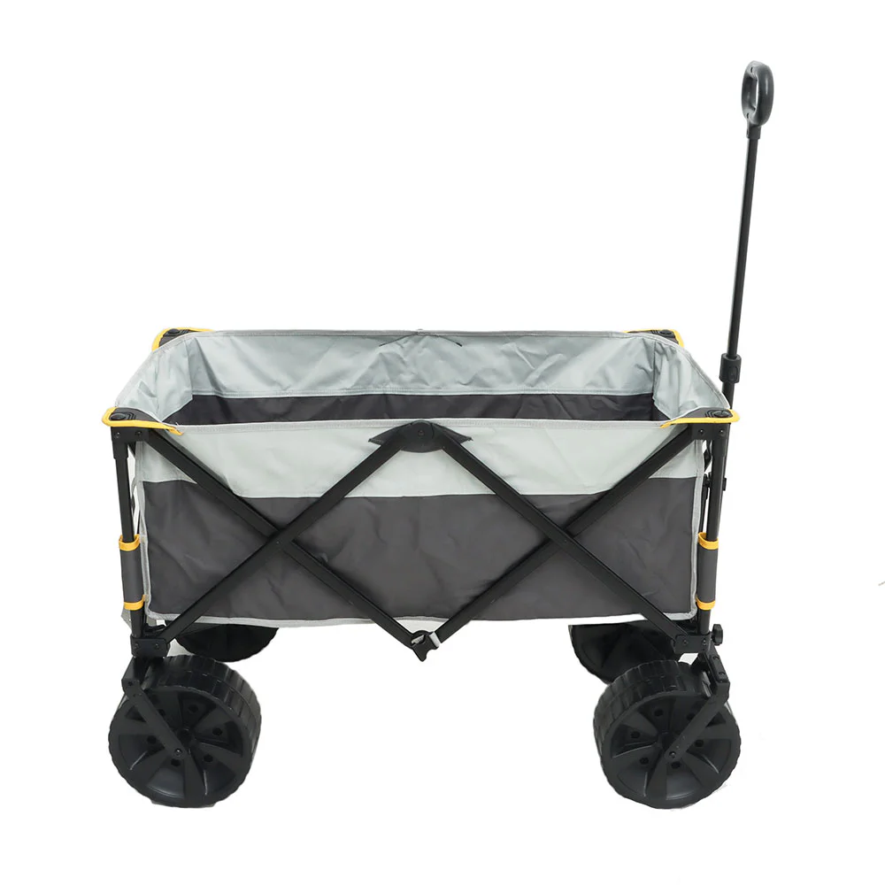 Campmaster folding all-terrain beach cart trolley with large wheels, fabric cargo compartment and extended pull handle.