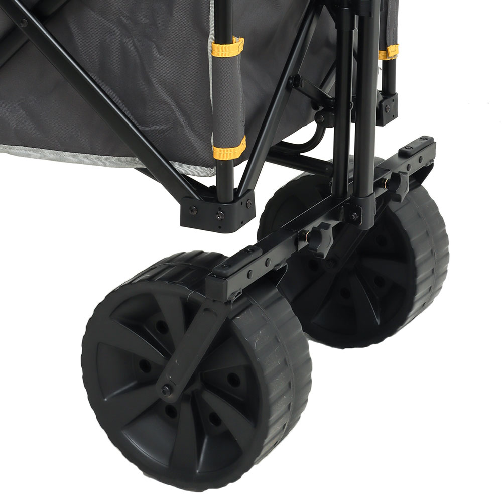 Campmaster folding all-terrain beach cart trolley with large wheels, fabric cargo compartment and extended pull handle.