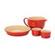 Chasseur 4-Piece Ceramic Bakeware & Prep Starter Set Four-piece red ceramic kitchen starter set featuring a large mixing jug, round pie dish, and two ramekins with cream interiors. Ideal for baking, mixing, preparing ingredients, and serving desserts, combining durable stoneware with a classic oven-to-table