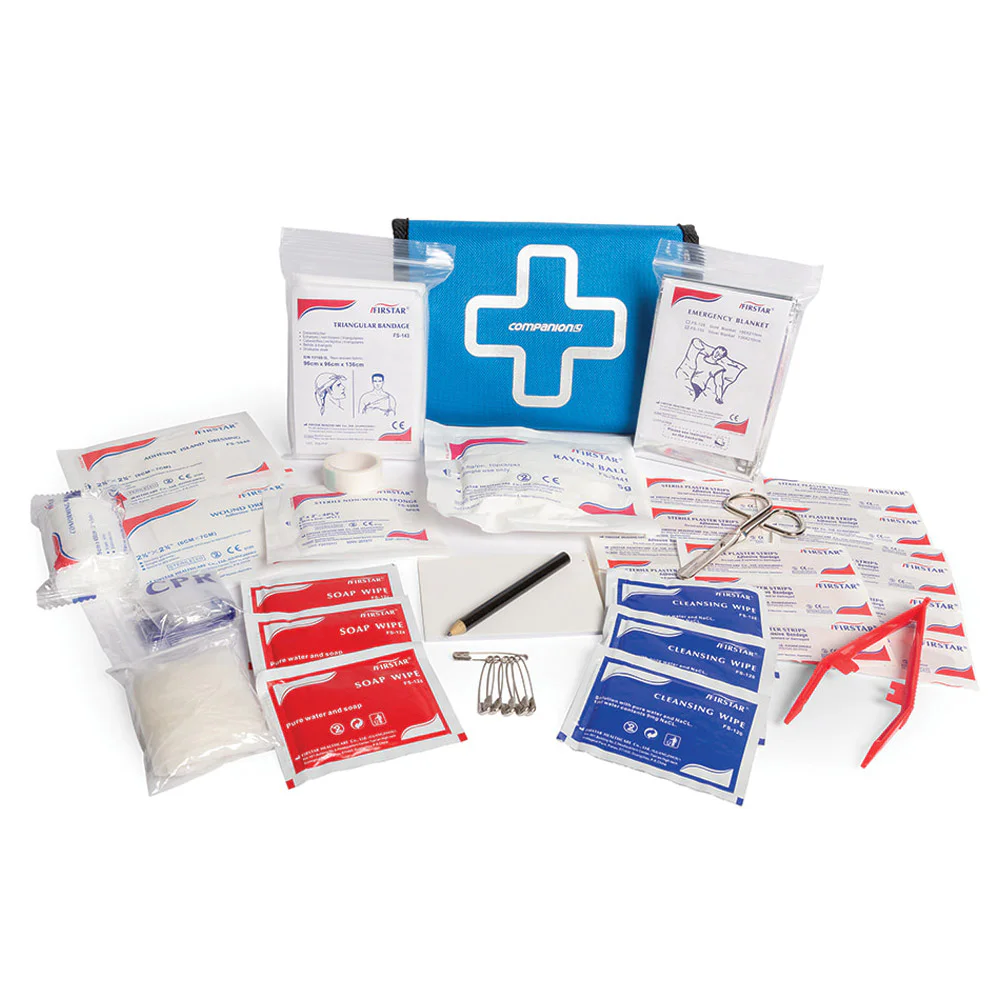 Compact 52-piece adventure first aid kit containing bandages, dressings, antiseptic wipes, tape, scissors, and essential medical supplies for outdoor activities and travel.