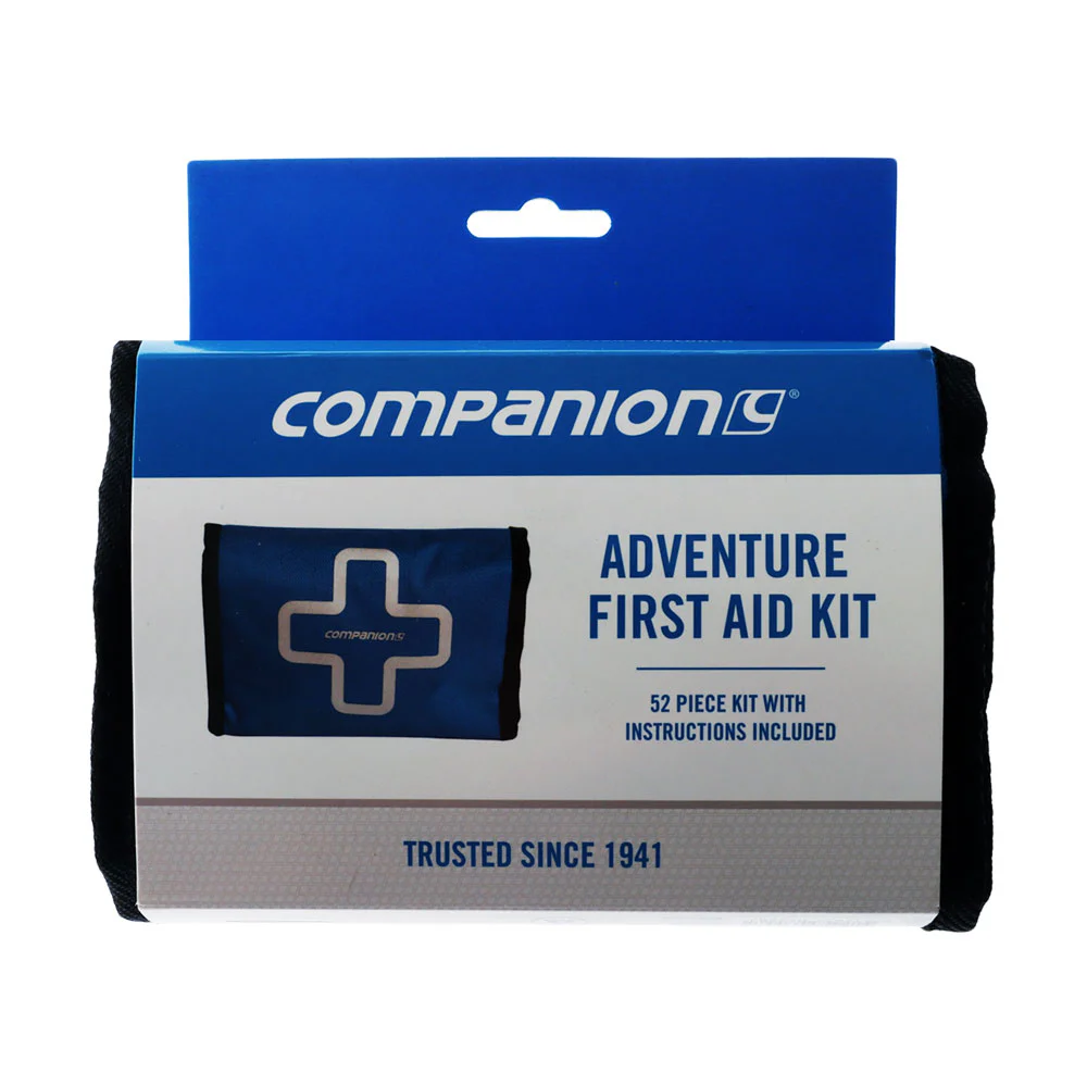 Compact 52-piece adventure first aid kit containing bandages, dressings, antiseptic wipes, tape, scissors, and essential medical supplies for outdoor activities and travel.