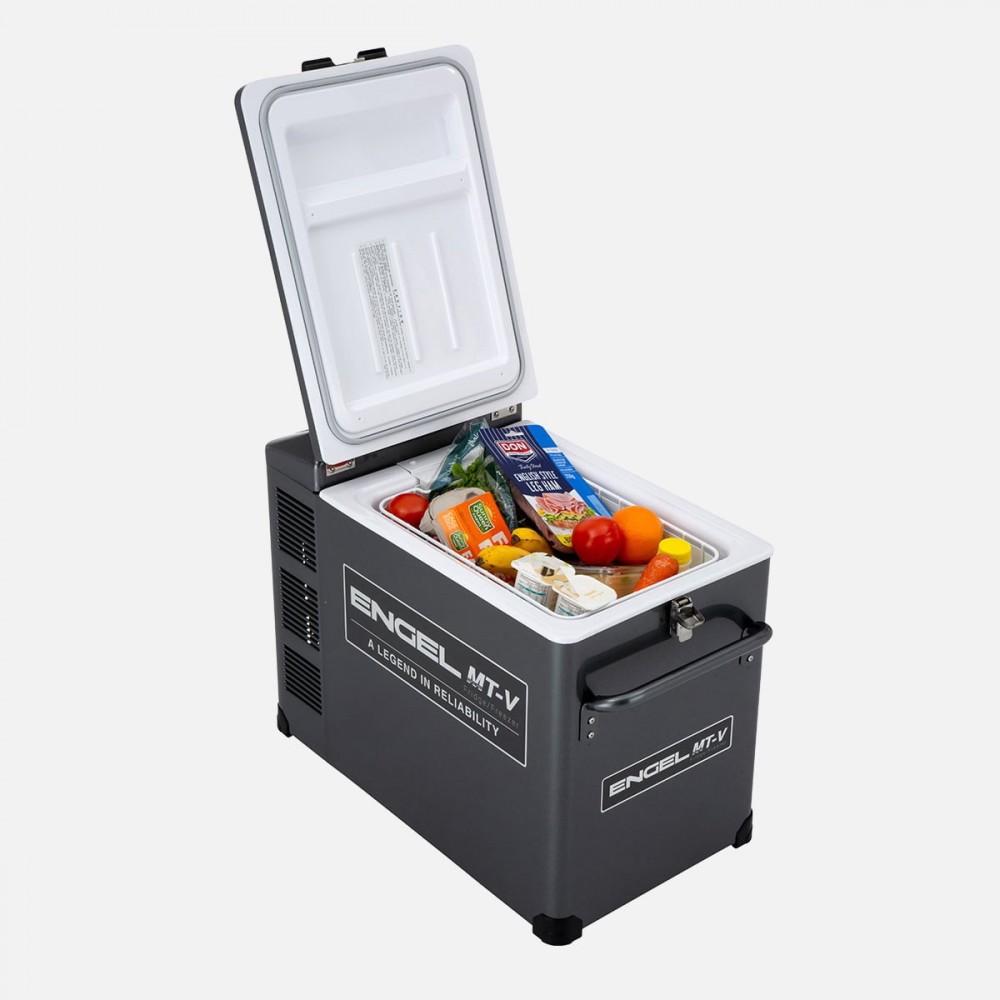 Engel MT-V portable fridge-freezer with a rugged grey powder-coated steel cabinet, secure locking lid, digital temperature controls, and sturdy carry handle, designed for reliable camping, caravanning, 4WD touring, boating, and off-grid food and drink ref