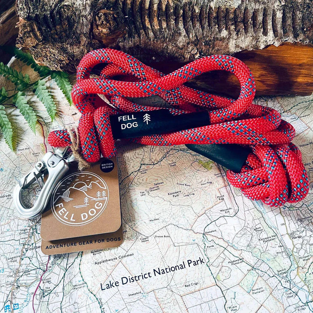 Orange Fell Dog Ridge rope lead with reflective detailing, knotted handle and silver metal trigger clip for secure dog walking.