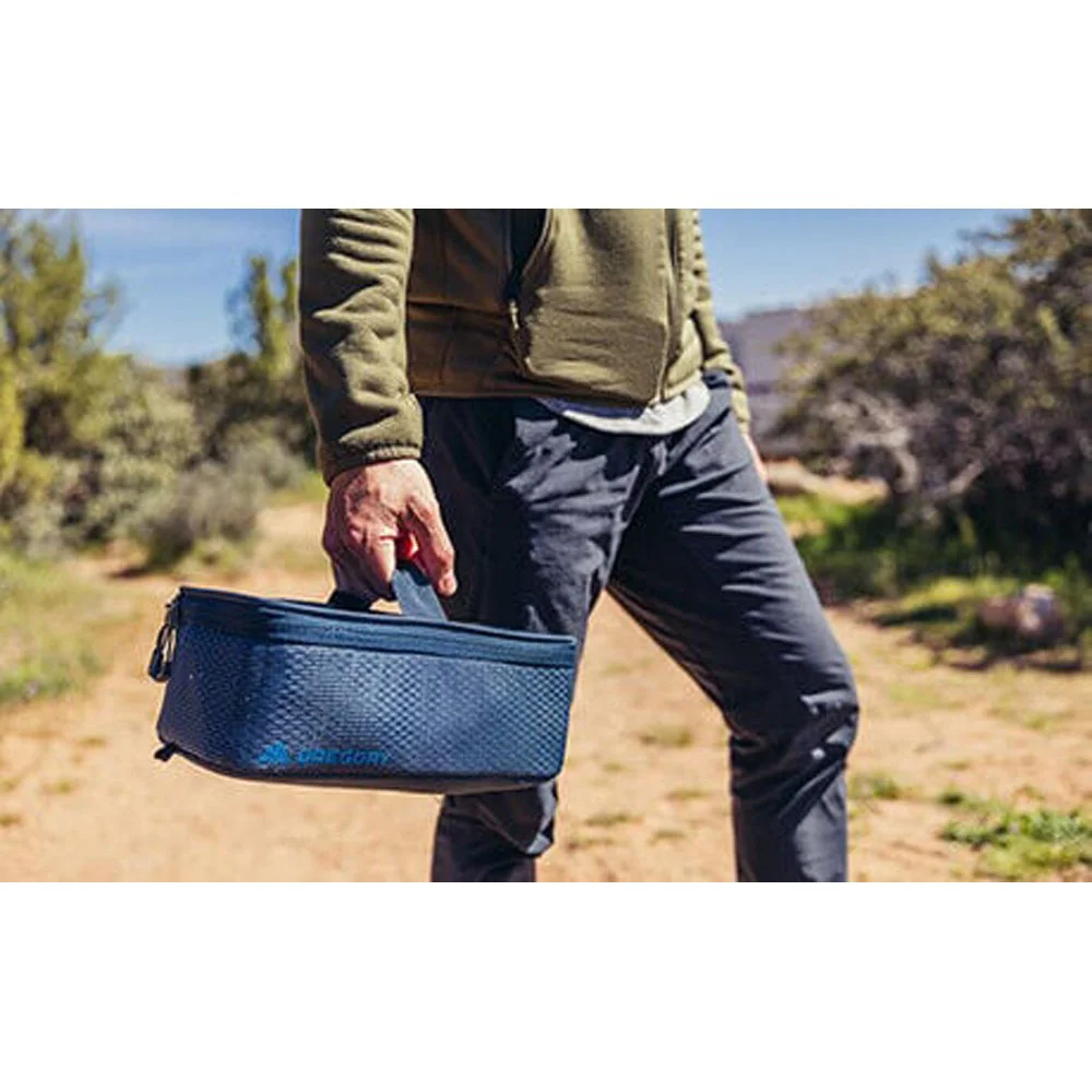 Gregory Alpaca Gear Pod 10L in tan with black mesh lid, carry handle and dual zip opening for organised storage of outdoor gear, travel items and accessories.