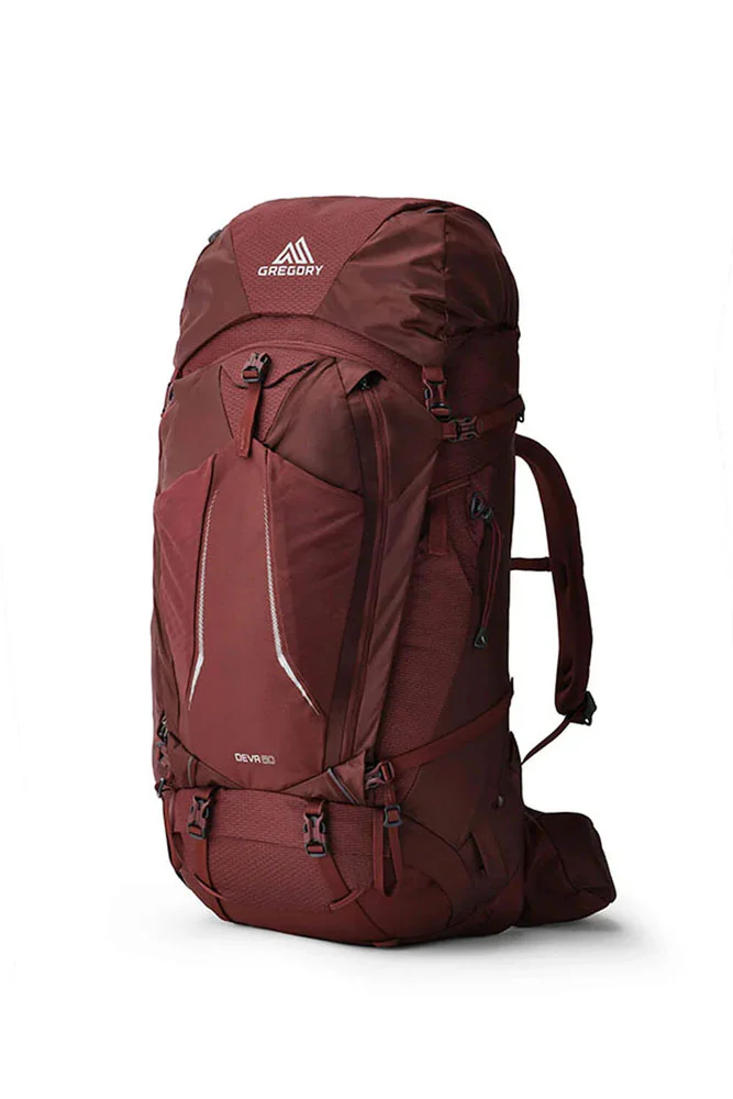 Gregory Deva women’s 60L backpacking pack in burgundy with adjustable shoulder straps, hip belt, multiple compartments and compression straps for multi-day hiking and tramping.
