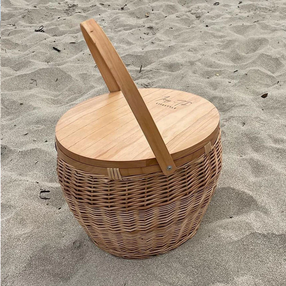 Icey-Tek insulated wicker picnic basket with a round wooden cheese board lid and curved carry handle, shown on a white background.