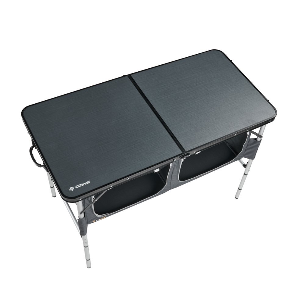 OZtrail Classic foldable camping table with black tabletop, integrated storage compartments and lightweight portable frame designed for camping, picnics and outdoor dining