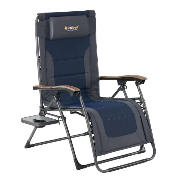 OZtrail Sun Lounge Jumbo recliner camping chair with padded navy seat, adjustable reclining backrest and integrated side table for outdoor relaxation and camping comfort