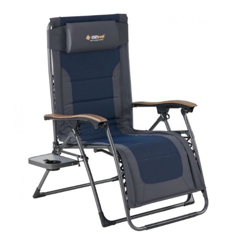 OZtrail Sun Lounge Jumbo recliner camping chair with padded navy seat, adjustable reclining backrest and integrated side table for outdoor relaxation and camping comfort