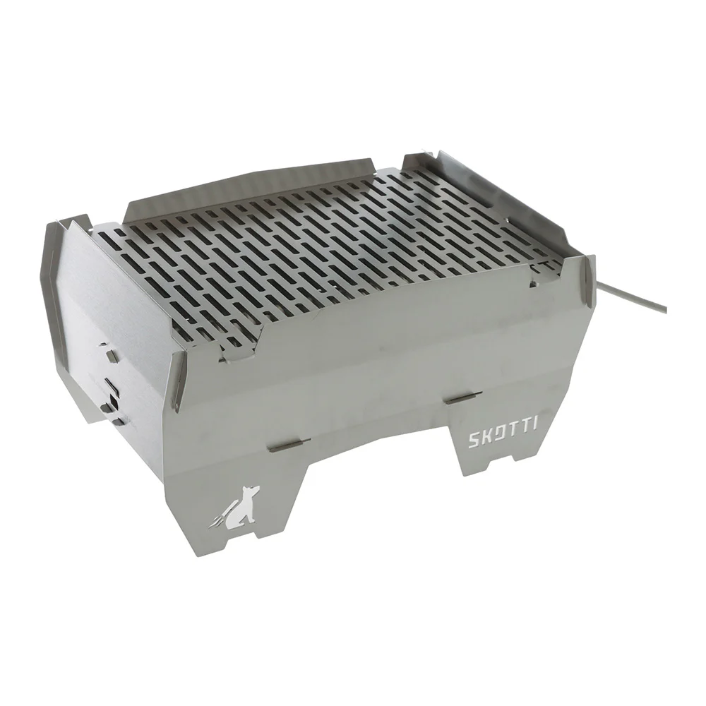 SKOTTI Stainless Steel Grill – Portable Gas BBQ SKOTTI portable stainless steel gas grill with compact flat-pack design, removable cooking grate and gas hose connection, ideal for camping, picnics, caravanning and outdoor cooking.