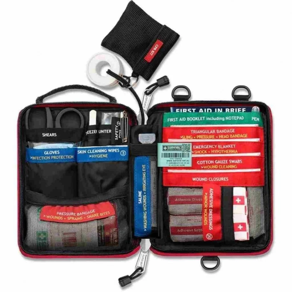 Compact personal first aid kit in a red zippered pouch with organized emergency medical supplies for hiking, camping, travel, outdoor adventures, and everyday preparedness.