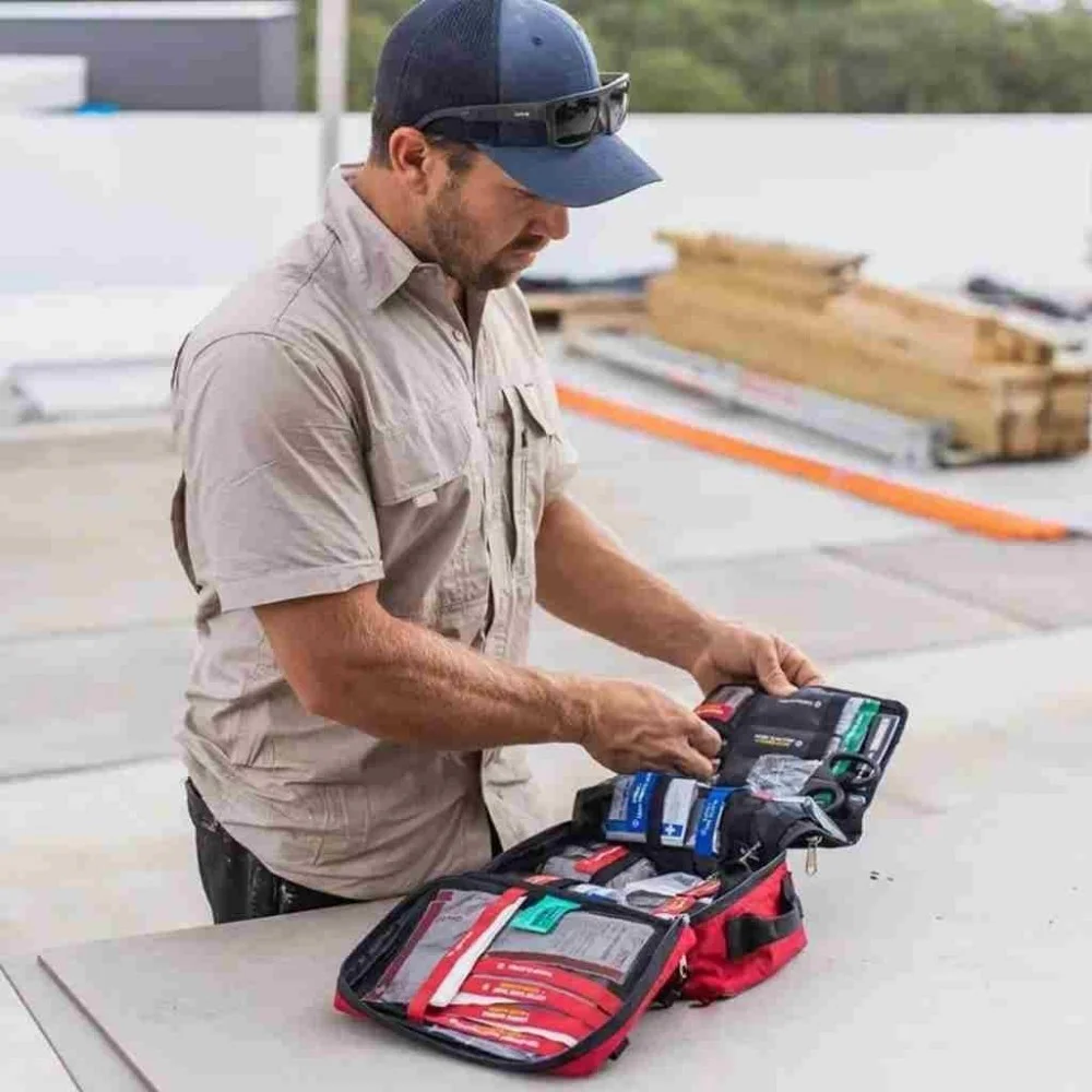 SURVIVAL Workplace First Aid Kit in a durable red zippered case with organized medical supplies for offices, job sites, warehouses, schools, and emergency preparedness.