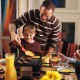 Swissmar Verso 8 person raclette grill with reversible cast iron grill and griddle top, individual raclette pans and adjustable heat control for indoor or outdoor dining.