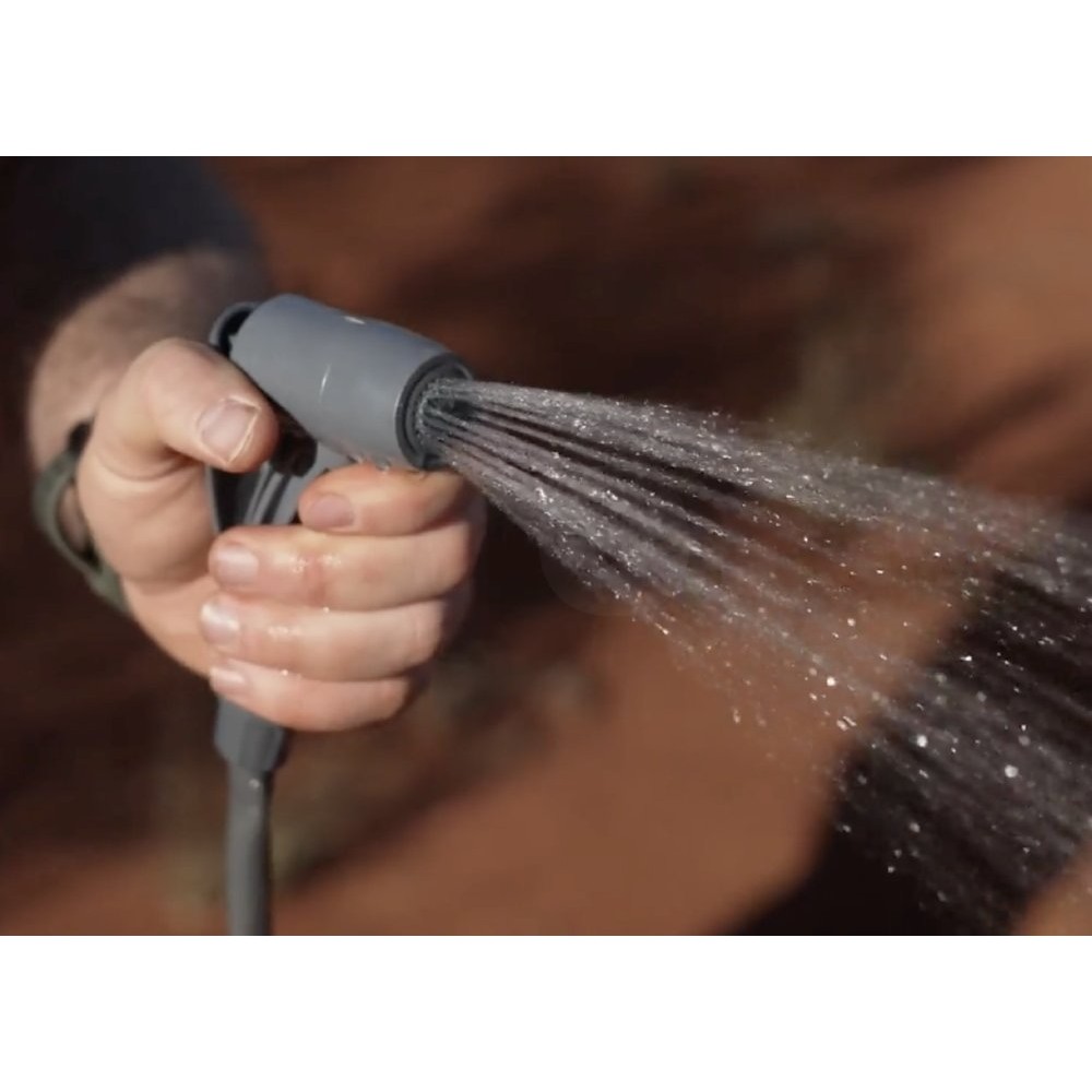 Wildtrak 15L portable camping shower with foot pump, hose, shower head and compact carry bag designed for camping, beach trips, outdoor cleaning and off-grid showering