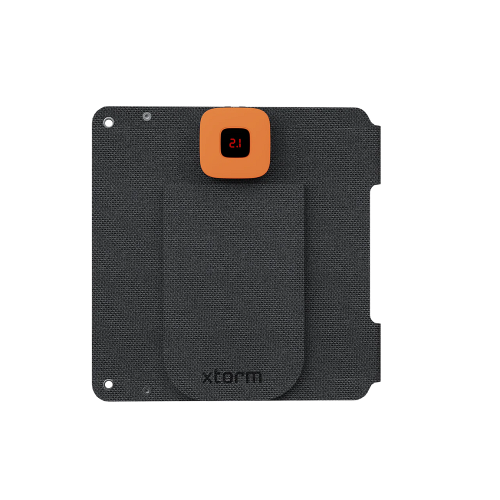 Xtorm SolarBooster 14W portable solar charger with foldable dual-panel design and lightweight construction for charging smartphones, power banks and USB devices during camping, hiking, travel and outdoor adventures.