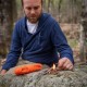 TinderCord Fire Starting Demonstration Outdoors Man lighting a fire using exposed inner tinder from SOL paracord