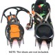 Heavy duty ice traction cleats attached to running shoe for snow hiking, mountaineering and winter trekking