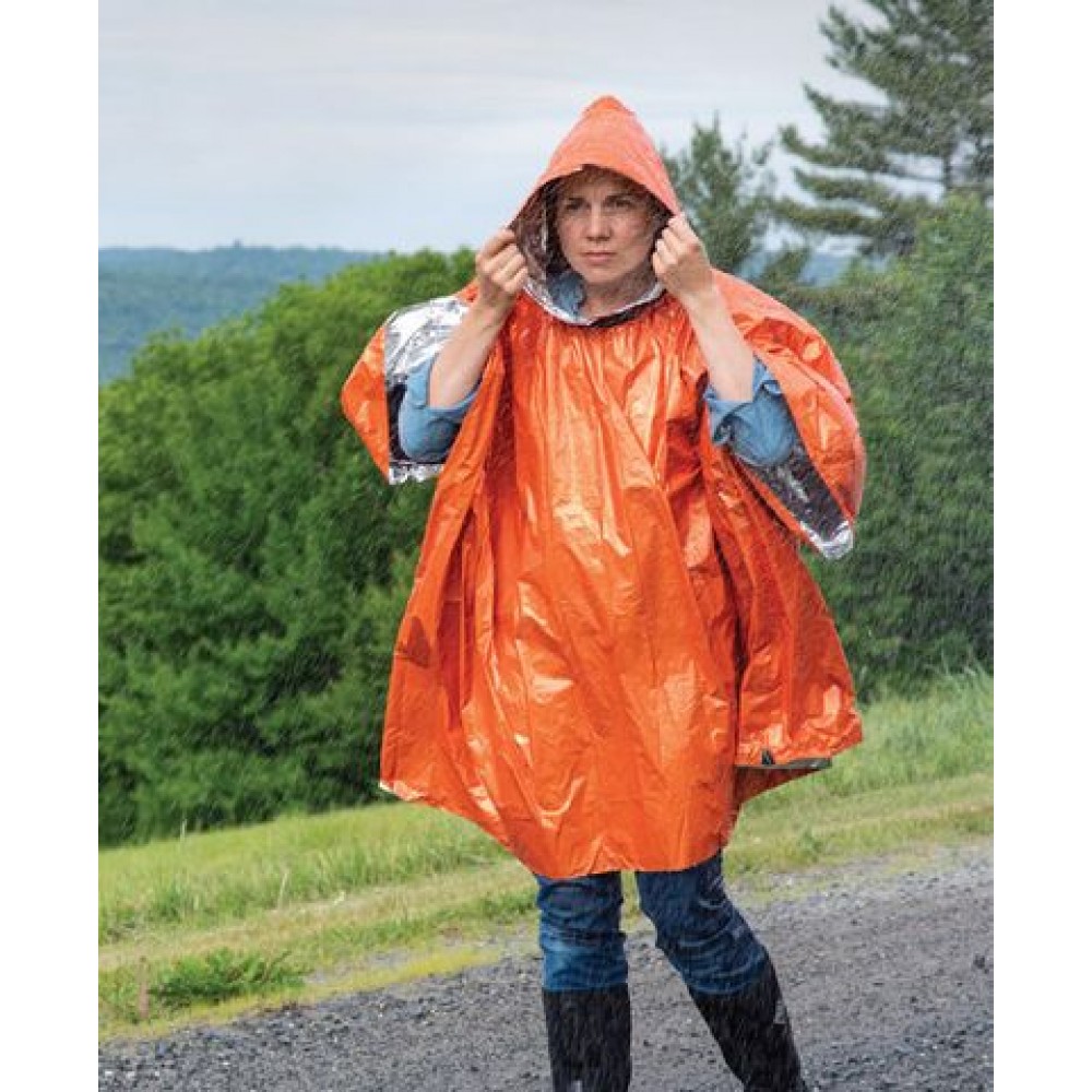 sol-heat-reflective-poncho-in-use-rain Woman wearing SOL Heat Reflective Poncho during rainstorm with hood up