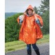 sol-heat-reflective-poncho-in-use-rain Woman wearing SOL Heat Reflective Poncho during rainstorm with hood up