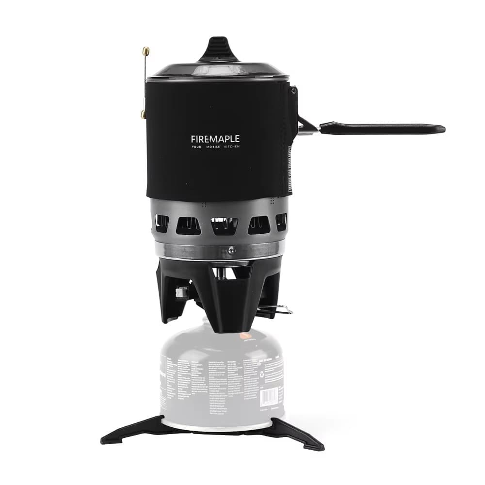 Compact FireMaple Star X3 outdoor cooking system in black with gas canister attached