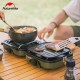 Naturehike dual burner gas stove being used to cook food outdoors at a campsite