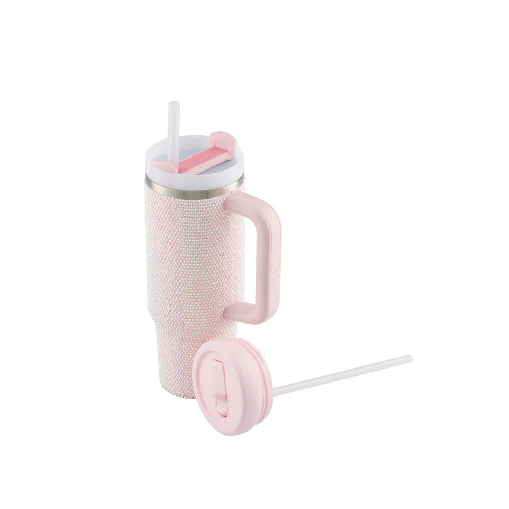 Luxe Pink insulated stainless steel tumbler with a large handle, reusable straw, and two interchangeable lids for convenient hot and cold beverage use.