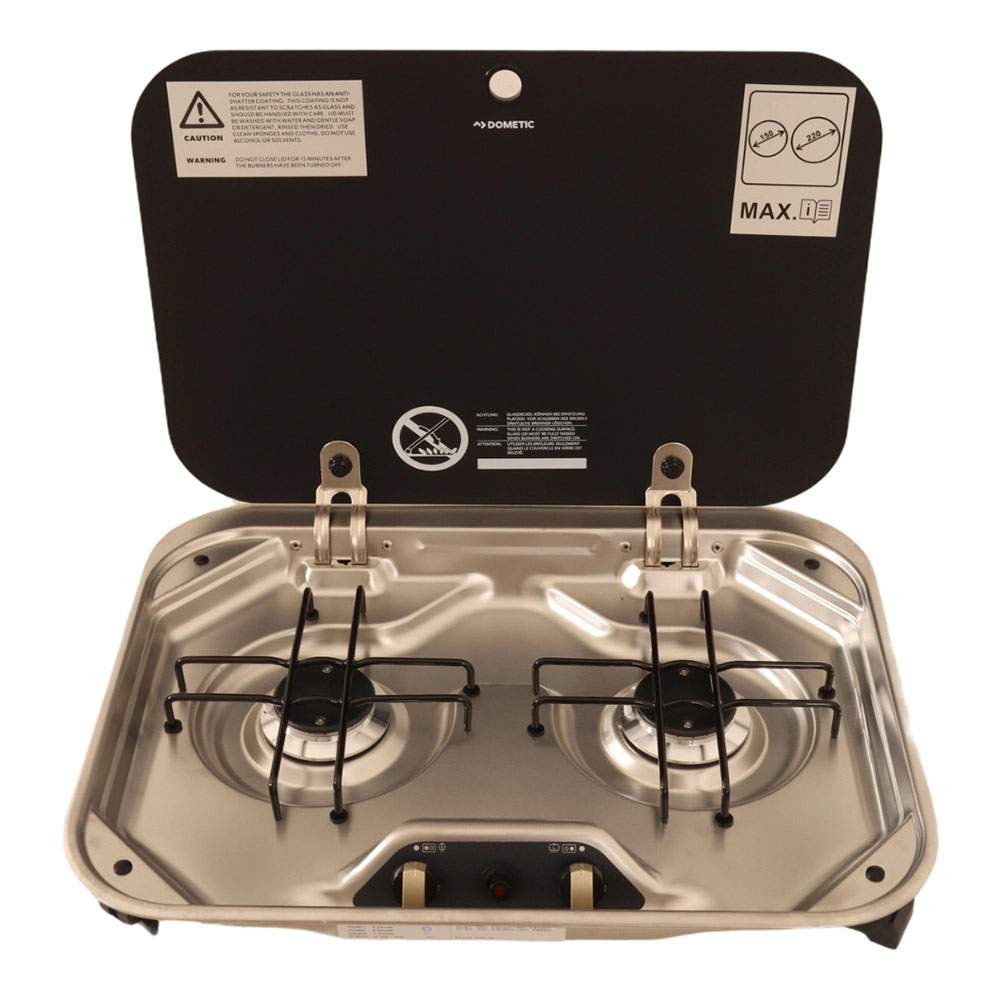 Dometic 2 Burner Gas Stove with Glass Lid Open Dometic 2 burner gas stove with glass lid open showing stainless steel hob for caravan and campervan kitchens