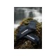 Pair of black waterproof outdoor socks displayed on mossy rocks near waterfall for hiking trekking and camping adventures