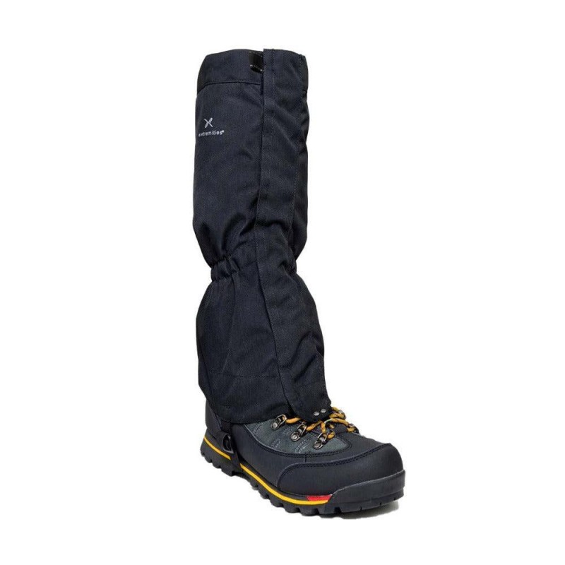 Black waterproof hiking gaiter attached to mountaineering boot for trekking walking backpacking and wet weather outdoor protection