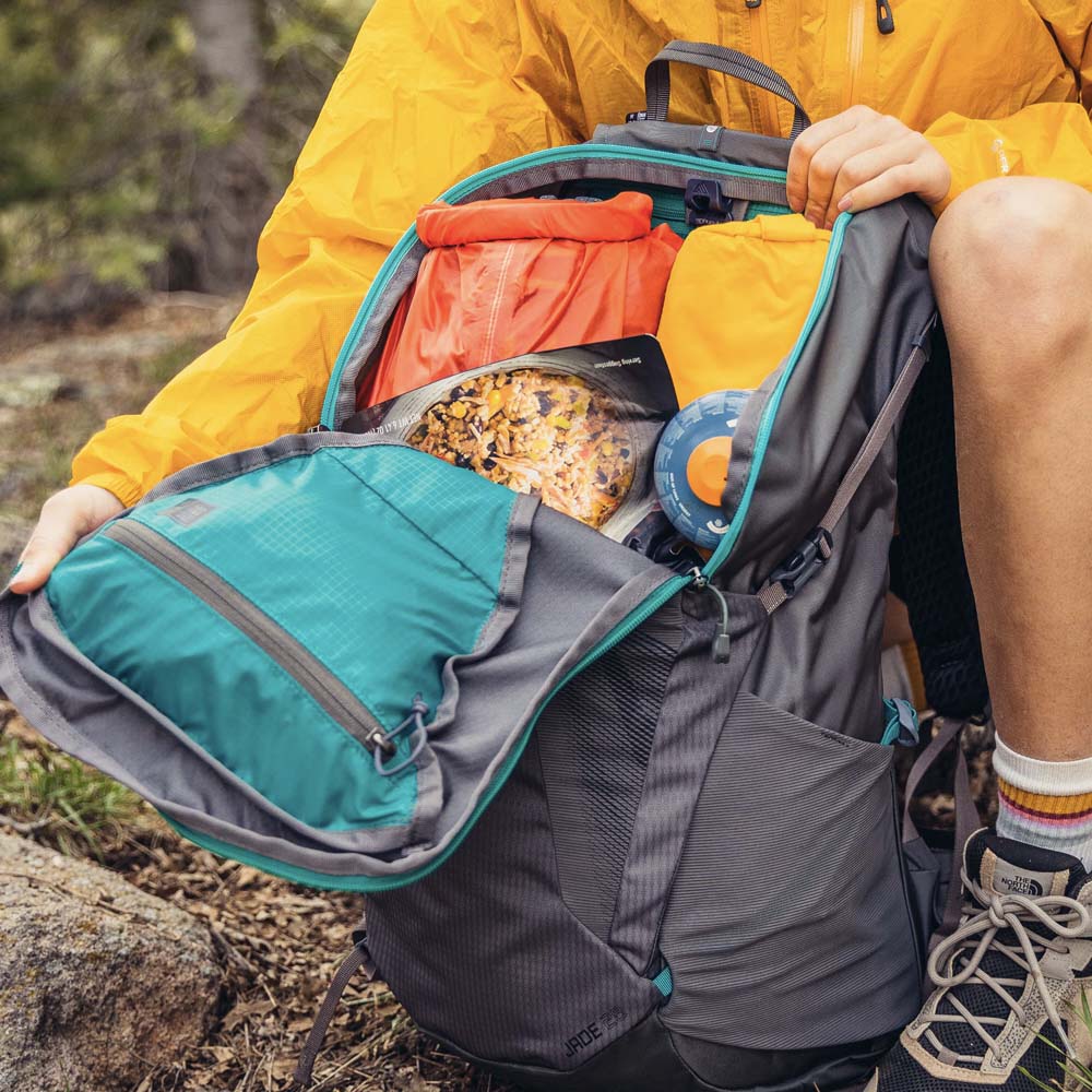 gregory jade 33l womens hiking backpack worn on trail trekking poles day hiking backpack women ergonomic fit outdoor adventure