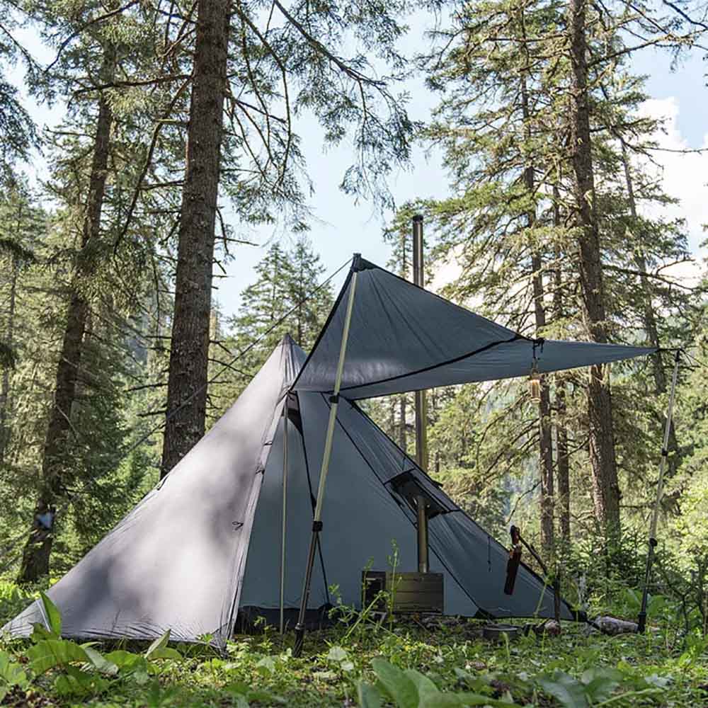 Pomoly HUSSAR 20 Winter Tent with Extended Awning Side view of Pomoly HUSSAR 20 hot tent with the door open and awning poles supporting the extended canopy.