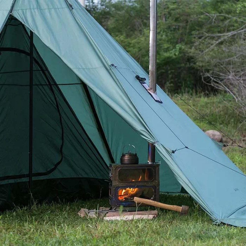 Pomoly HUSSAR Plus 2.0 Tipi Tent with Stove Inside Inside view of the tent with a wood stove and kettle heating in NZ bush