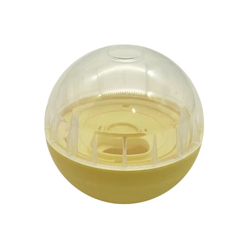Interactive slow feeder treat dispensing ball toy in yellow and transparent finish designed for dogs and cats to promote puzzle play, treat rewards and slower eating habits