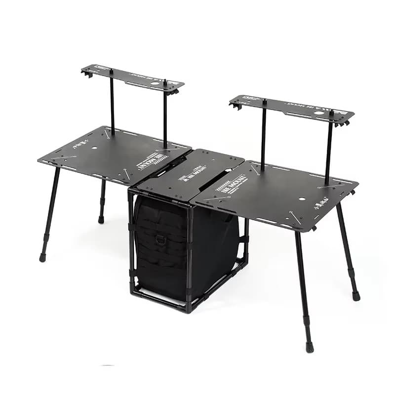 Foldable camping table fully extended with modular side tables and central black storage compartment.