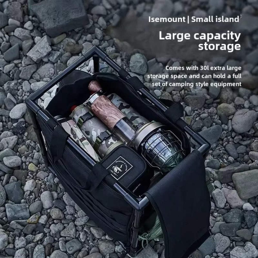 Top-down view of storage box filled with flashlights, bags, and lanterns on rocky ground.