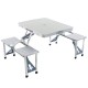 Portable aluminium folding camping table with integrated bench seats for outdoor camping and picnic use