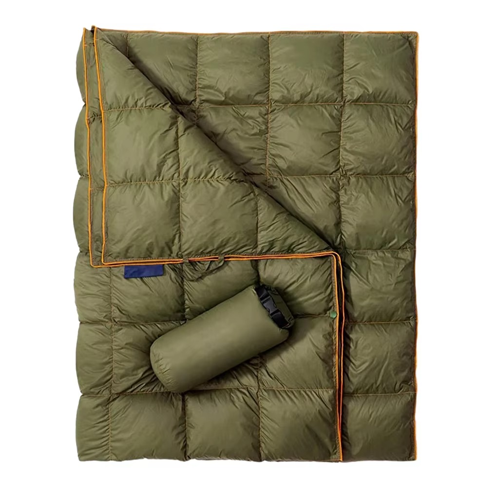 Lightweight down camping blanket featuring insulated quilted construction, water-resistant outer fabric, and compact packable design with included storage sack. This versatile outdoor blanket provides exceptional warmth for camping, backpacking, hiking, v
