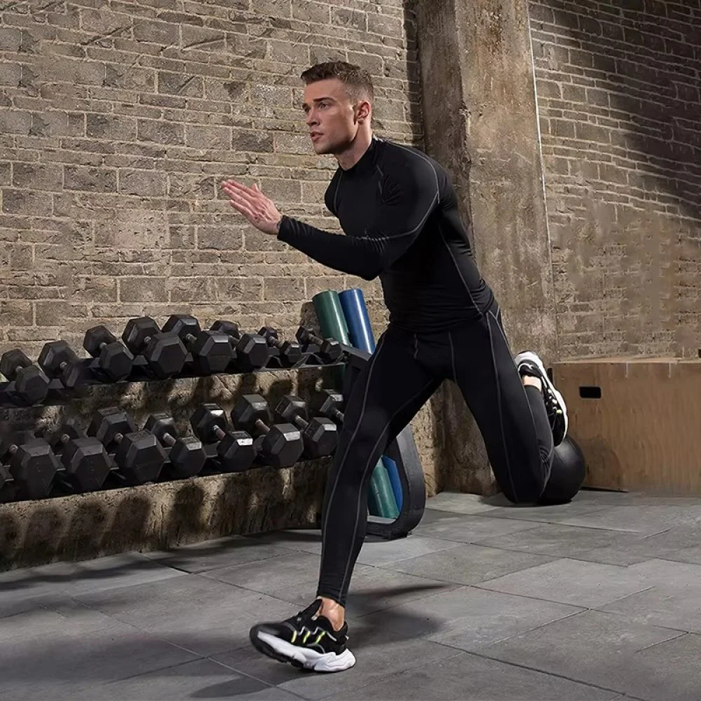 Men's Long Sleeve Compression Sports T-Shirt Men's long sleeve compression sports t-shirt in black with contrast stitching, designed for training, running, gym workouts, fitness, cycling, and outdoor sports. Features a slim-fit athletic design with moisture-wicking, stretch fabric for enhanced perfo
