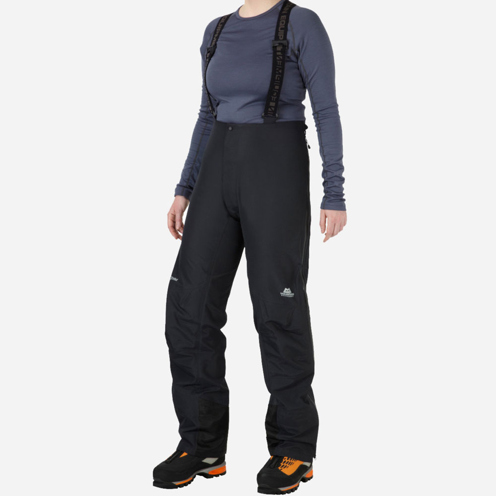 Durable black waterproof trousers for women with adjustable braces and articulated fit, built for alpine and winter climbing conditions