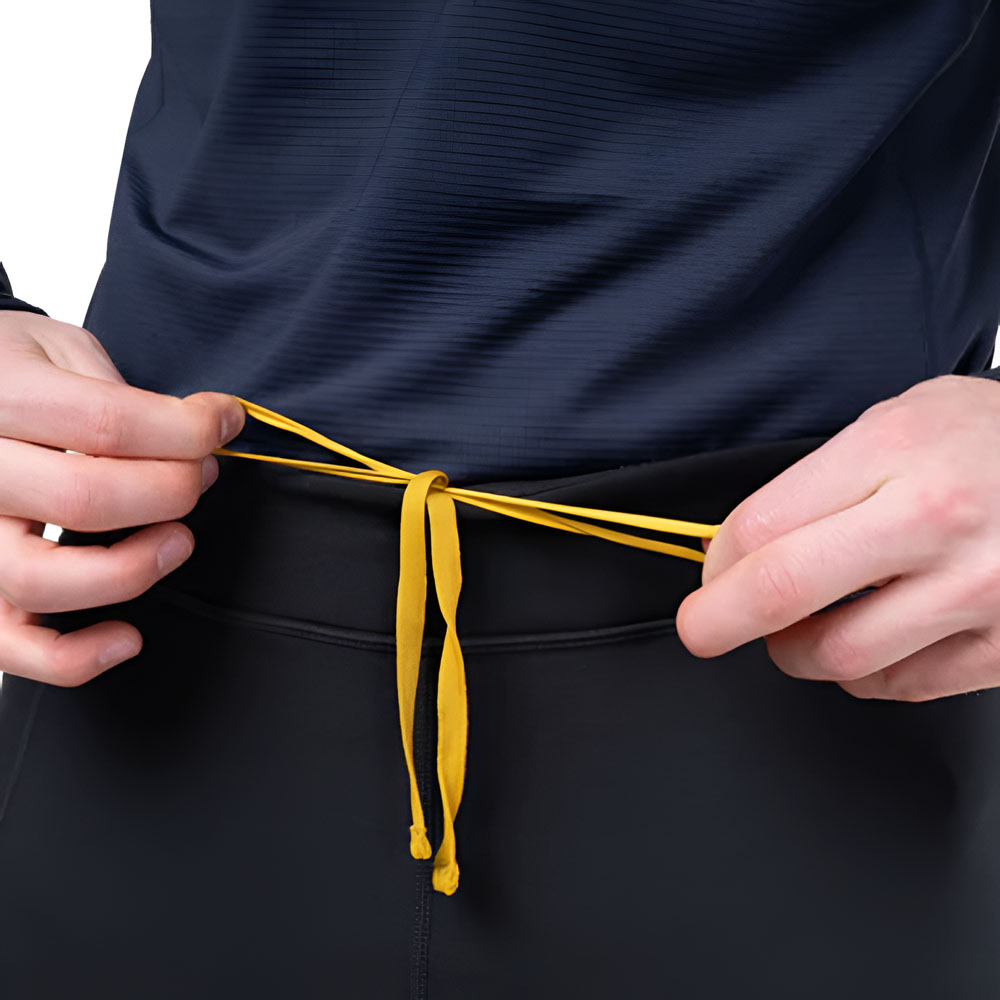 Mountain Equipment Jorasses Lite Men's 3/4 Tight - Waist Drawcord Detail Close-up of yellow drawcord being tied at waistband of black technical 3/4 tights