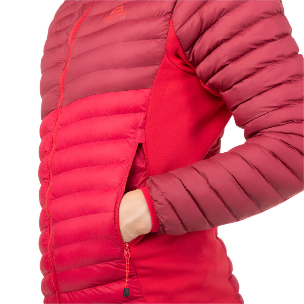Close-up of hand in side zip pocket of red and crimson Mountain Equipment Particle Hooded women’s jacket