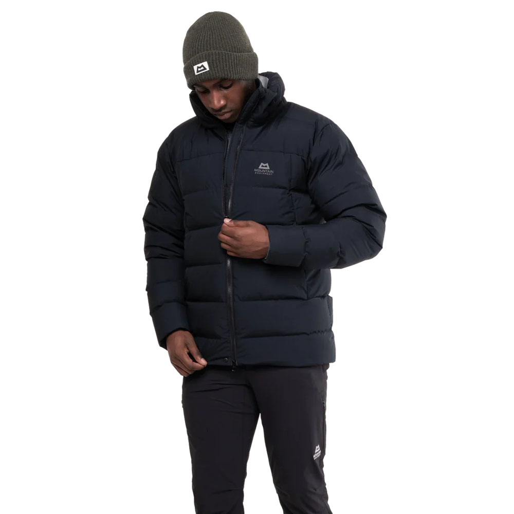 Black insulated hooded jacket with box wall construction and Mountain Equipment logo on chest