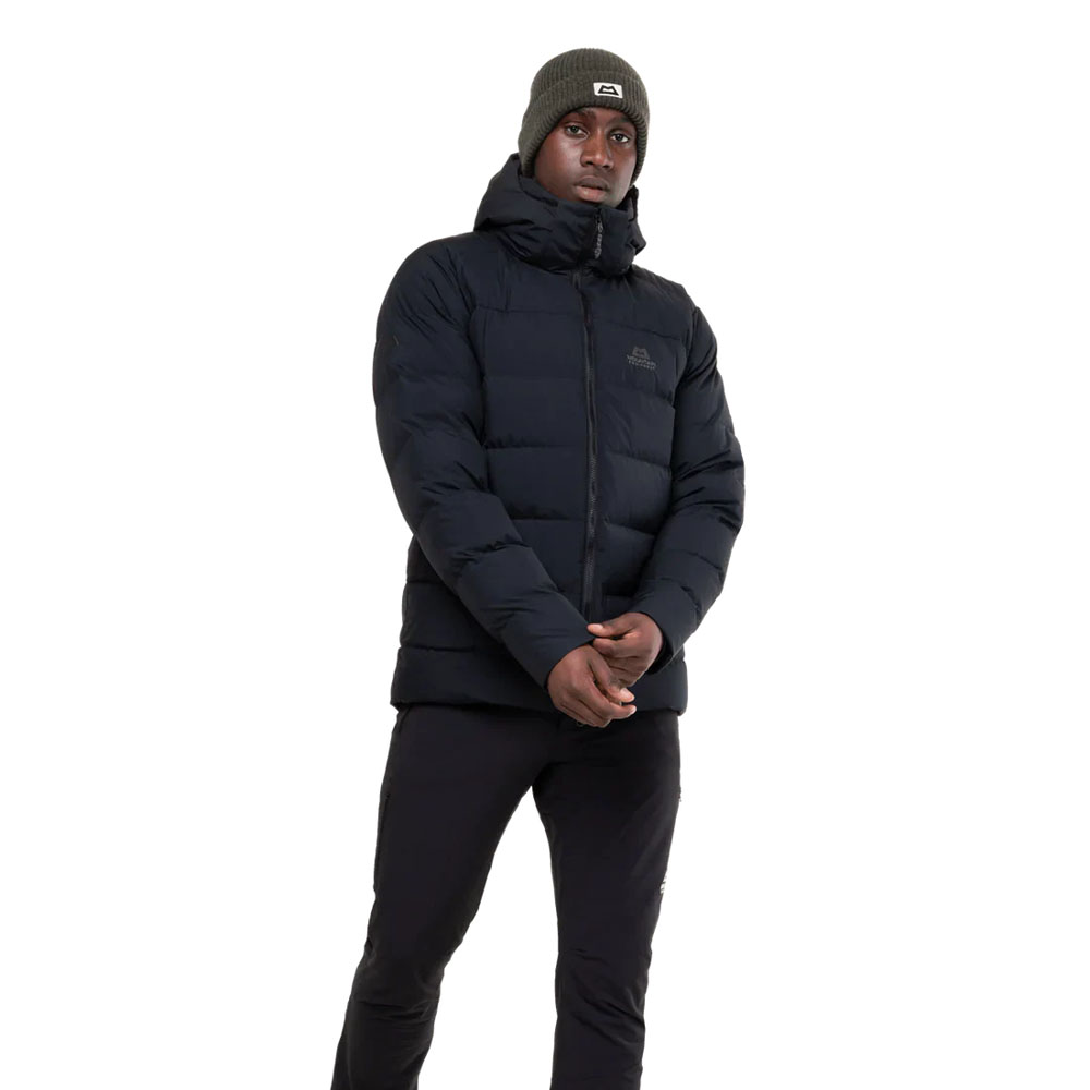 Black insulated hooded jacket with box wall construction and Mountain Equipment logo on chest