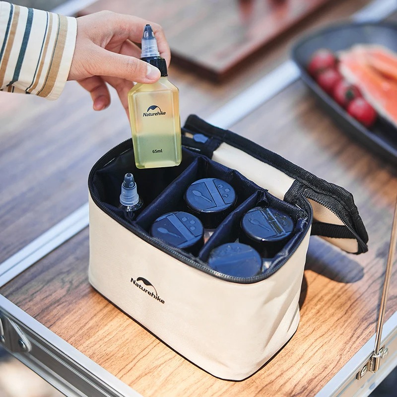 Naturehike camping sauce bottles and spice containers organized inside portable zippered storage bag for outdoor cooking