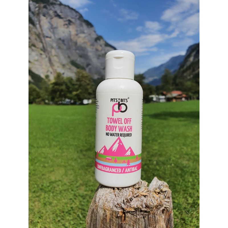 Front view of the Pits & Bits Towel Off Body Wash bottle with pink mountain design and “Unfragranced / Antibac” label