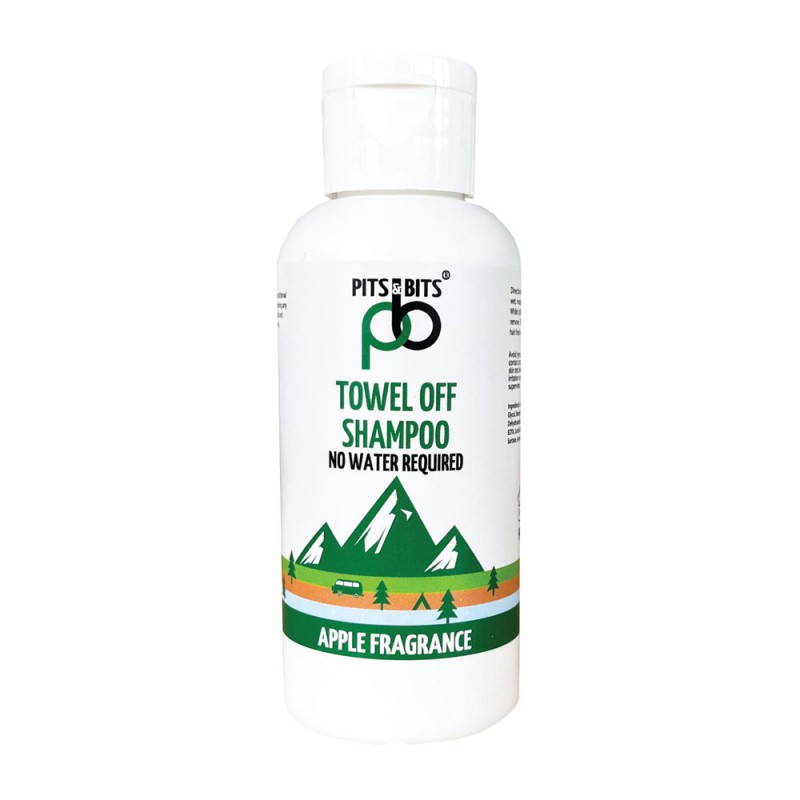 Front view of Pits & Bits no-rinse shampoo bottle with green apple fragrance label and mountain illustration