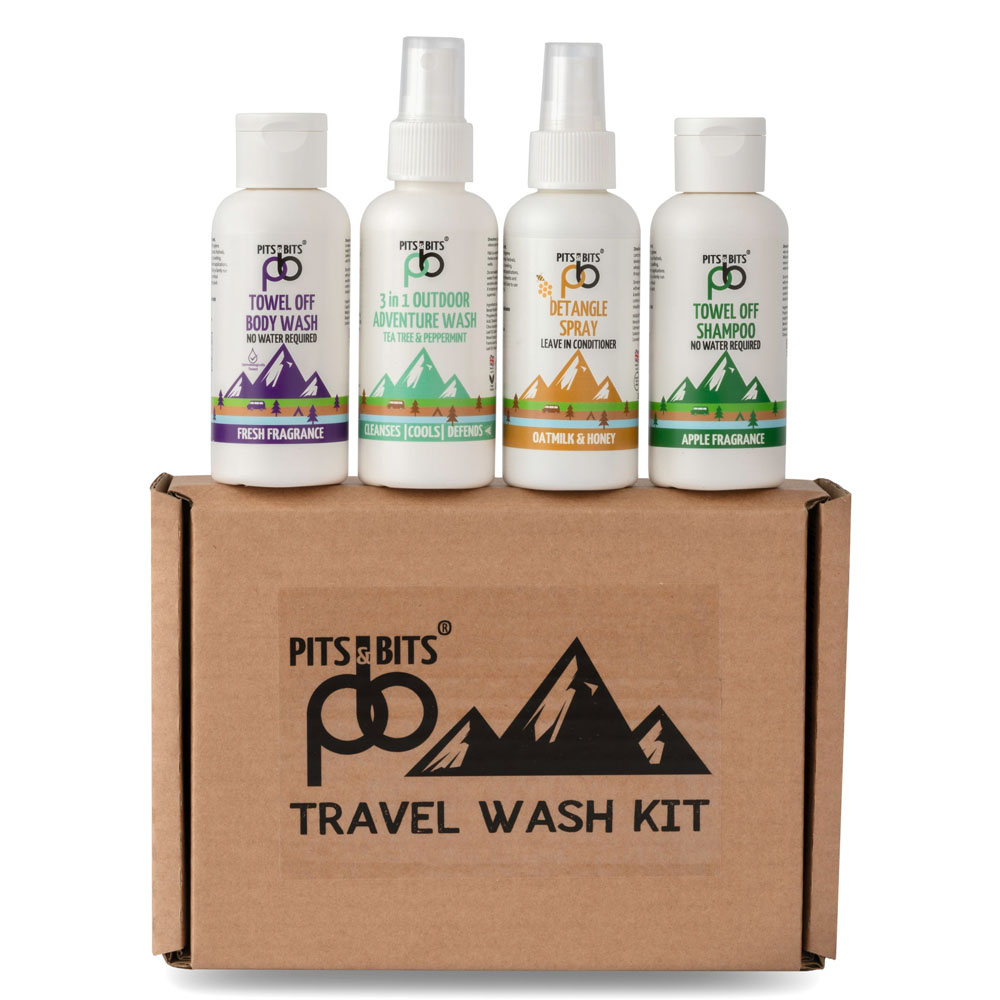 Full set of Pits & Bits travel wash kit bottles displayed on a branded cardboard box