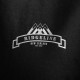 Close up of Ridgeline New Zealand logo printed on black mens fleece hoodie